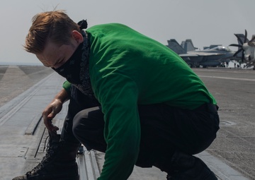 Sailor Performs Maintenance