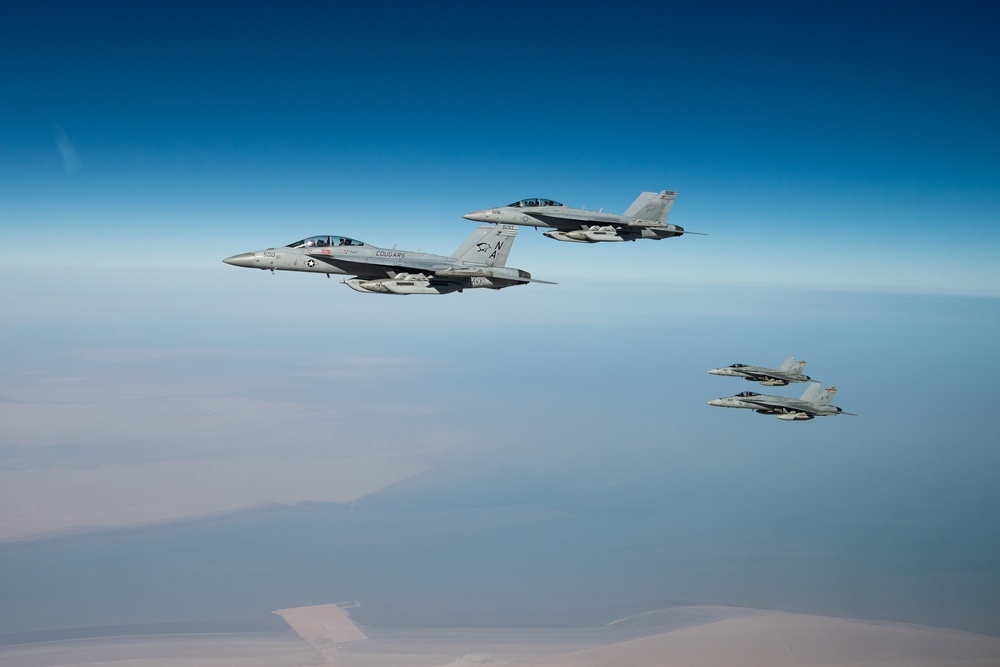 A U.S. Air Force KC-135 Stratotanker refuels F-18