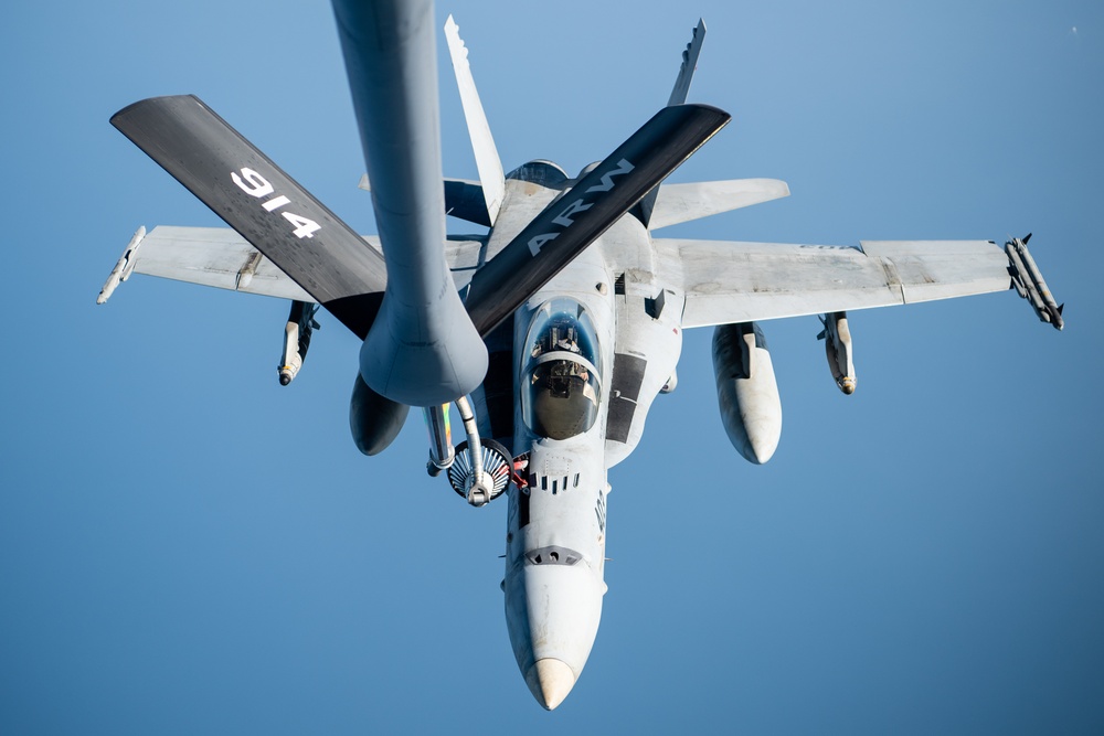 A U.S. Air Force KC-135 Stratotanker refuels F-18