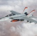 A U.S. Air Force KC-135 Stratotanker refuels a Navy F/A-18 Super Hornet