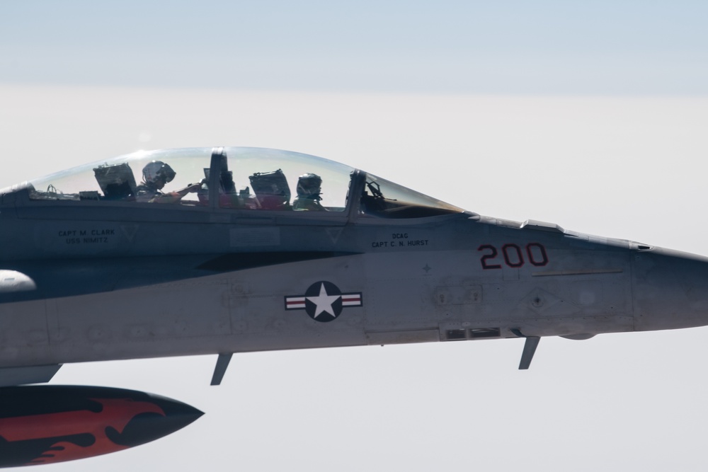 A U.S. Air Force KC-135 Stratotanker refuels a Navy F/A-18 Super Hornet