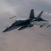 A U.S. Air Force KC-135 Stratotanker refuels a Navy F/A-18 Super Hornet