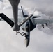 A U.S. Air Force KC-135 Stratotanker refuels Navy F/A-18 Super Hornets