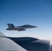 A U.S. Air Force KC-135 Stratotanker refuels a Navy F/A-18 Super Hornet