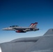 A U.S. Air Force KC-135 Stratotanker refuels a Navy F/A-18 Super Hornet