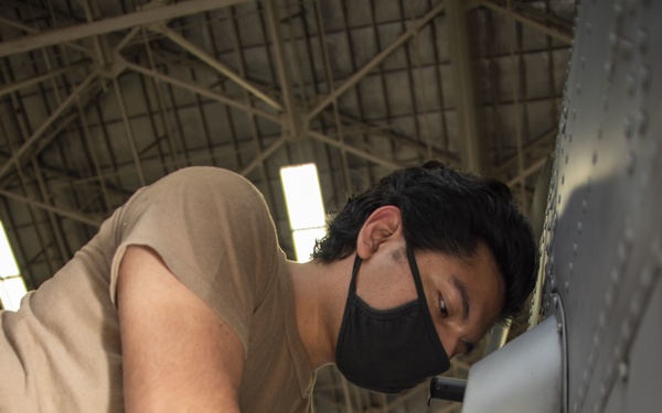 HSM-51 Sailor Performs Maintenance