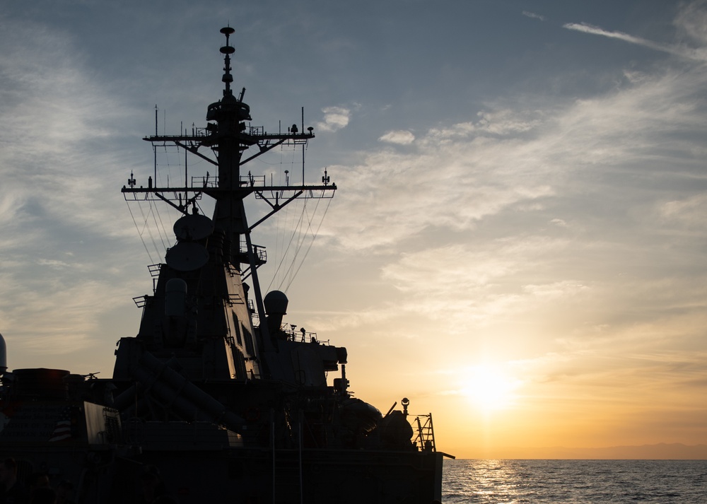 USS Barry Sails At Sunset