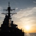 USS Barry Sails At Sunset