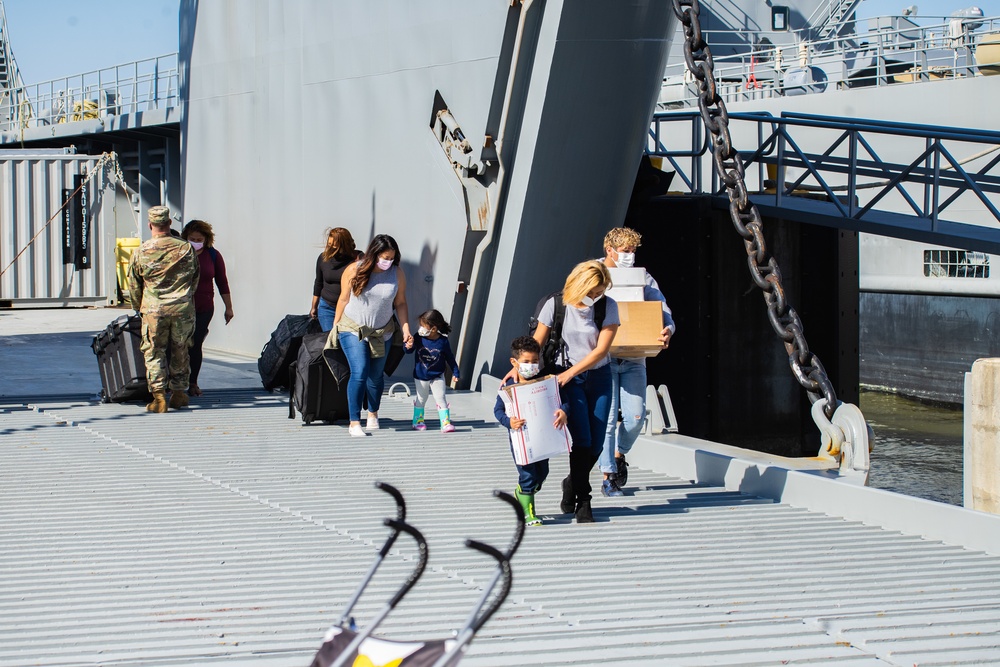 Crew Members From LSV 6 Unload their Gear With Family Members