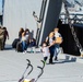 Crew Members From LSV 6 Unload their Gear With Family Members