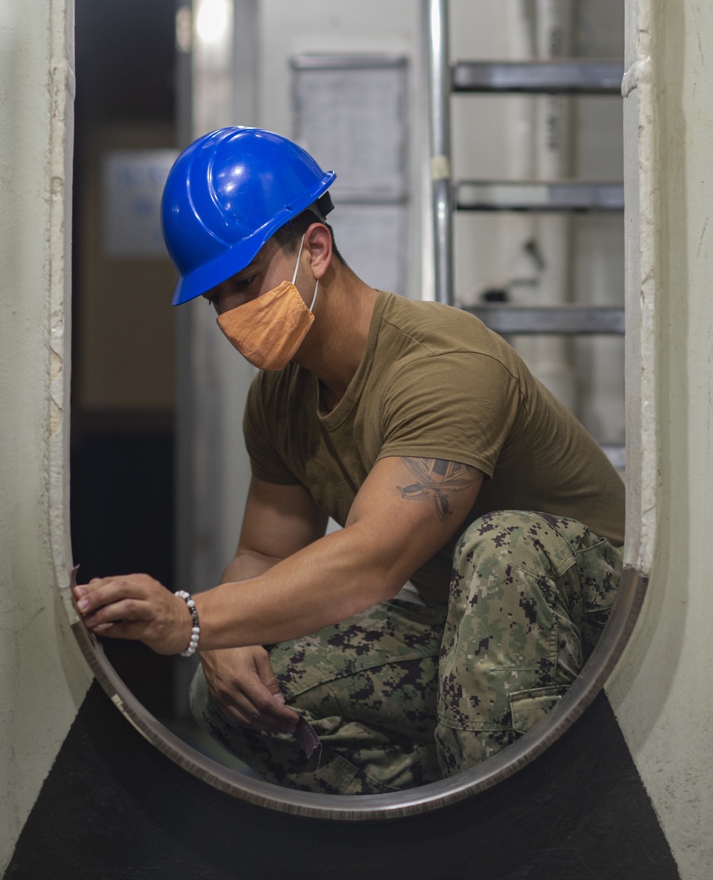 GHWB Sailor Cleans Passageway