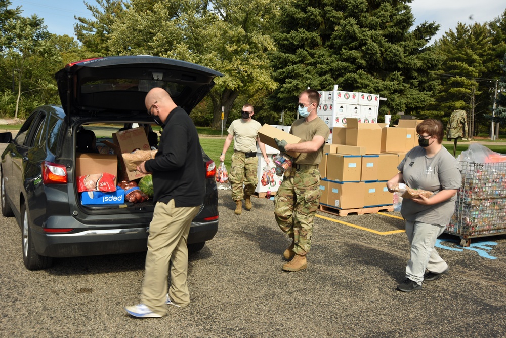 Members from the 110th Wing Battle Creek work with the Food Bank of South Michigan