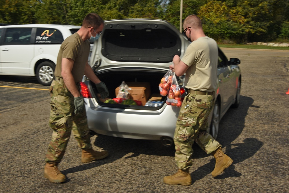 Members from the 110th Wing Battle Creek work with the Food Bank of South Michigan