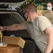 Members from the 110th Wing Battle Creek work with the Food Bank of South Michigan