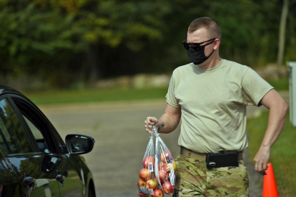 Members from the 110th Wing Battle Creek work with the Food Bank of South Michigan