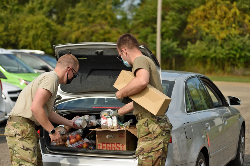 Members from the 110th Wing Battle Creek work with the Food Bank of South Michigan