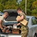 Members from the 110th Wing Battle Creek work with the Food Bank of South Michigan