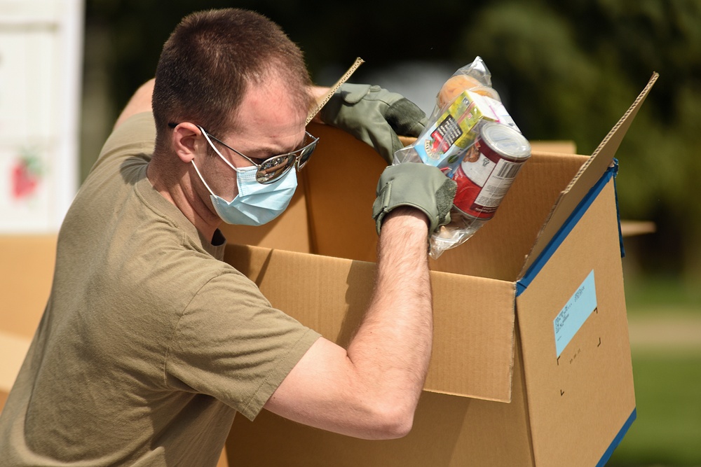 Members from the 110th Wing Battle Creek work with the Food Bank of South Michigan