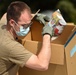 Members from the 110th Wing Battle Creek work with the Food Bank of South Michigan