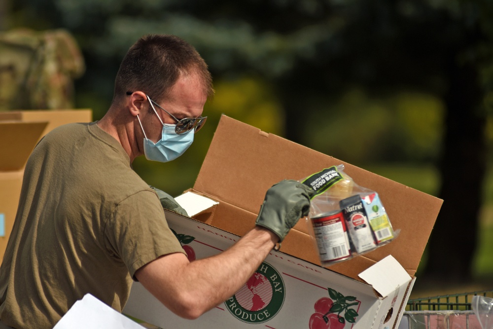 Members from the 110th Wing Battle Creek work with the Food Bank of South Michigan