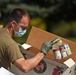 Members from the 110th Wing Battle Creek work with the Food Bank of South Michigan