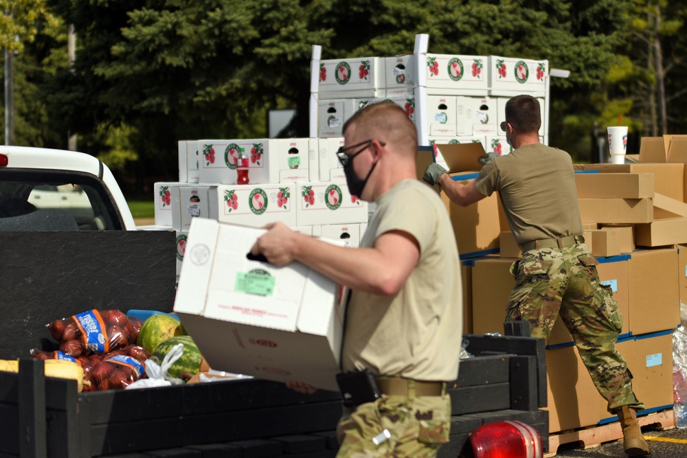 Members from the 110th Wing Battle Creek work with the Food Bank of South Michigan