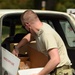 Members from the 110th Wing Battle Creek work with the Food Bank of South Michigan