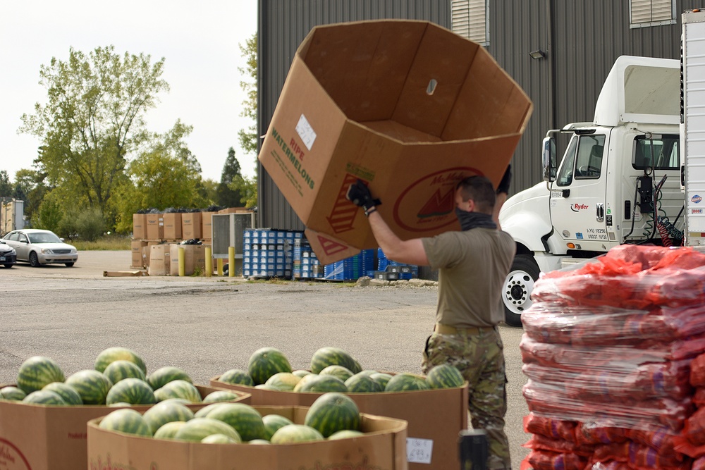 Members from the 110th Wing Battle Creek work with the Food Bank of South Michigan