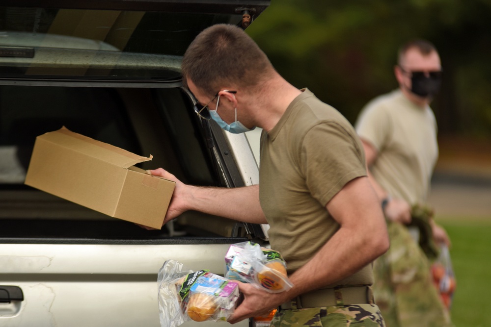 Members from the 110th Wing Battle Creek work with the Food Bank of South Michigan