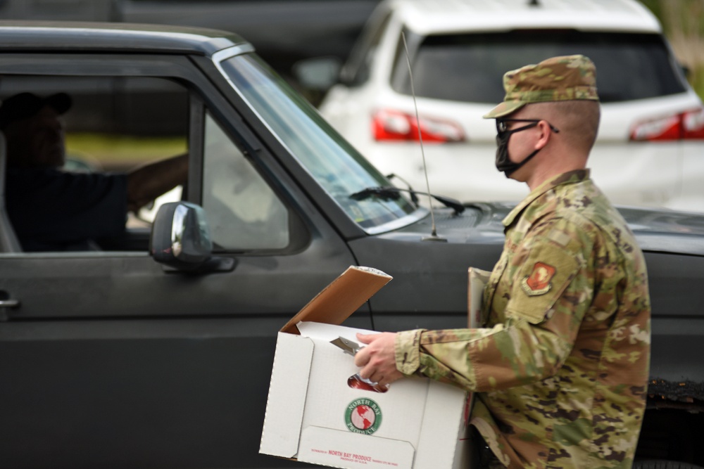 Members from the 110th Wing Battle Creek work with the Food Bank of South Michigan