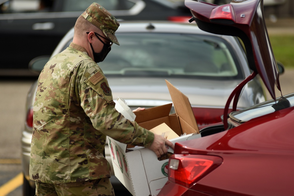 Members from the 110th Wing Battle Creek work with the Food Bank of South Michigan