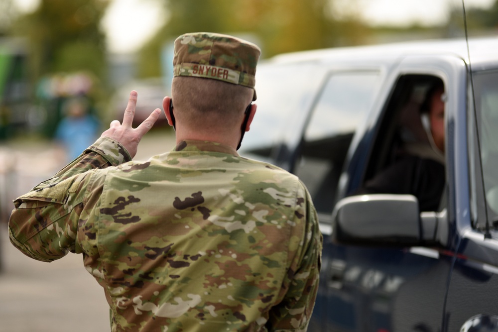 Members from the 110th Wing Battle Creek work with the Food Bank of South Michigan