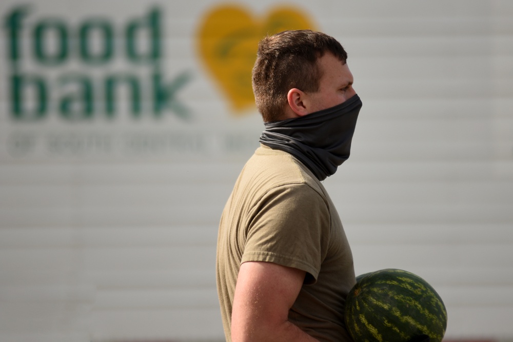 Members from the 110th Wing Battle Creek work with the Food Bank of South Michigan