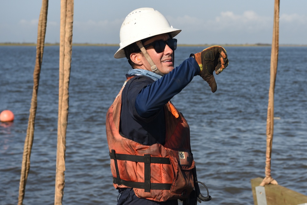 Coast Guard construction tender works in Sabine Pass post Hurricane Delta