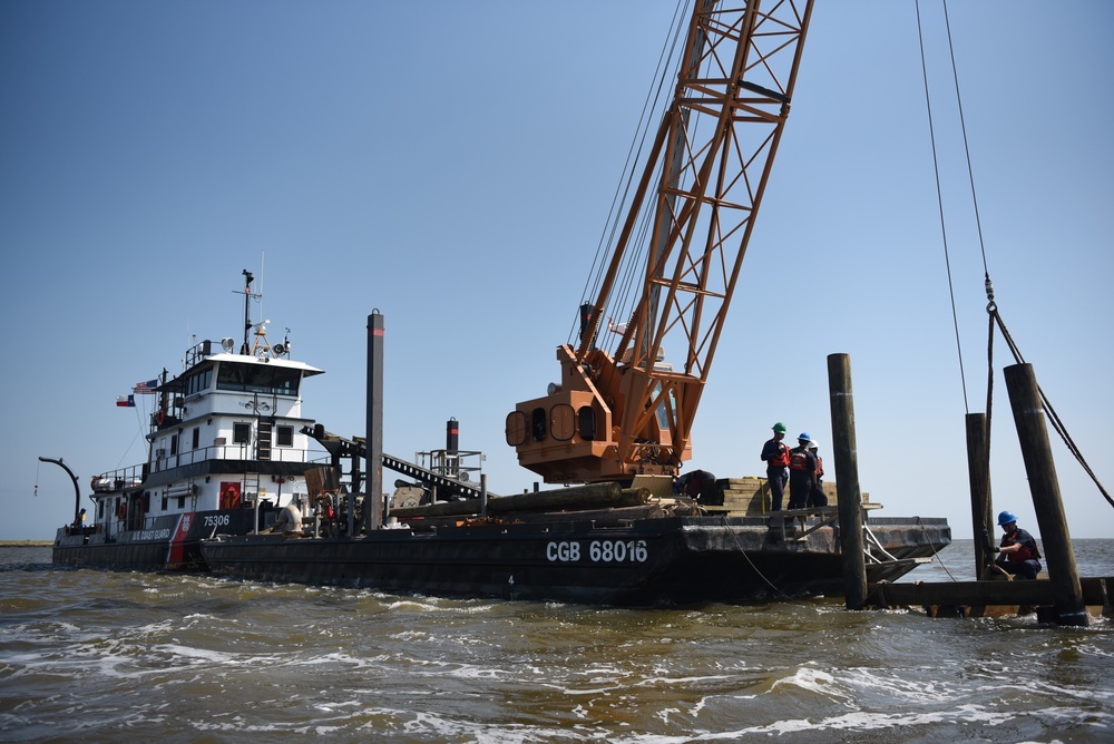 Coast Guard construction tender works in Sabine Pass post Hurricane Delta