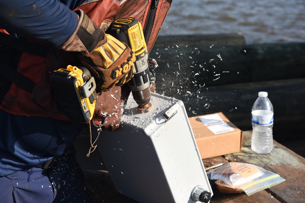 Coast Guard construction tender works in Sabine Pass post Hurricane Delta