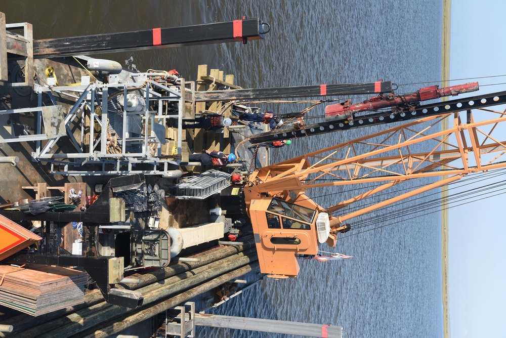 Coast Guard construction tender works in Sabine Pass post Hurricane Delta