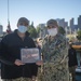 Logistic Specialist 1st Class David Kerley reenlists aboard the USS Constitution