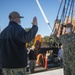 Logistic Specialist 1st Class David Kerley reenlists aboard the USS Constitution.