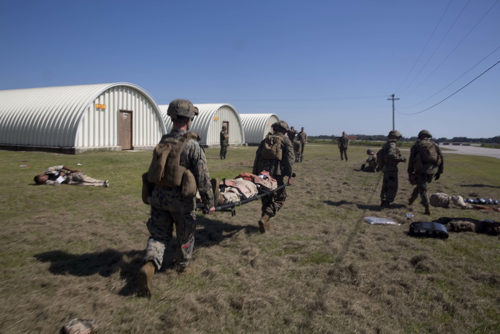 Sailors and Marines conduct a mass casualty evacuation