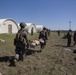 Sailors and Marines conduct a mass casualty evacuation