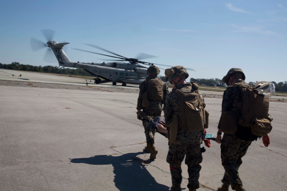 Sailors and Marines conduct a mass casualty evacuation