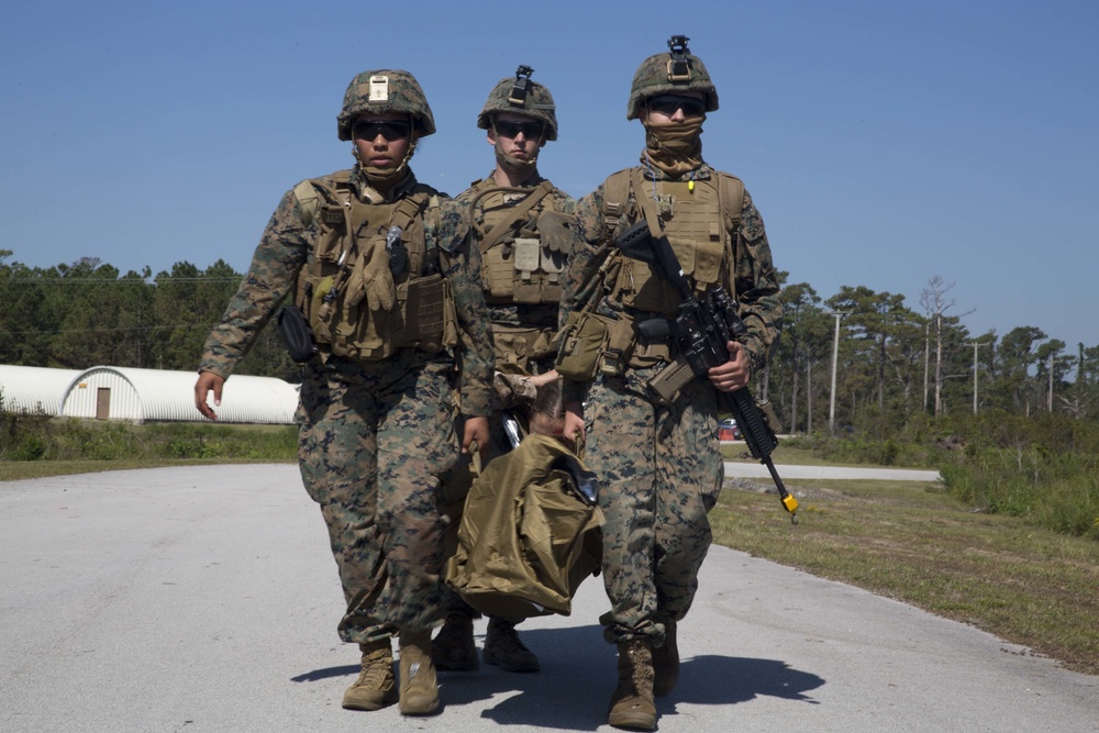 Sailors and Marines conduct a mass casualty evacuation