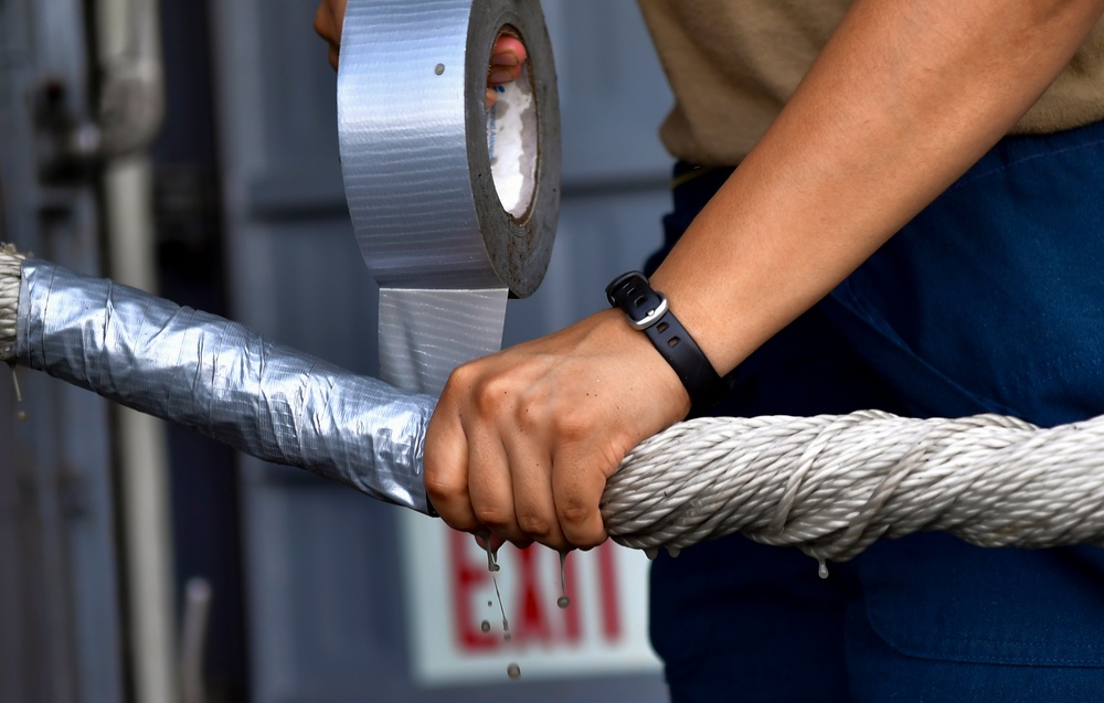 Sailor wraps Mooring Line