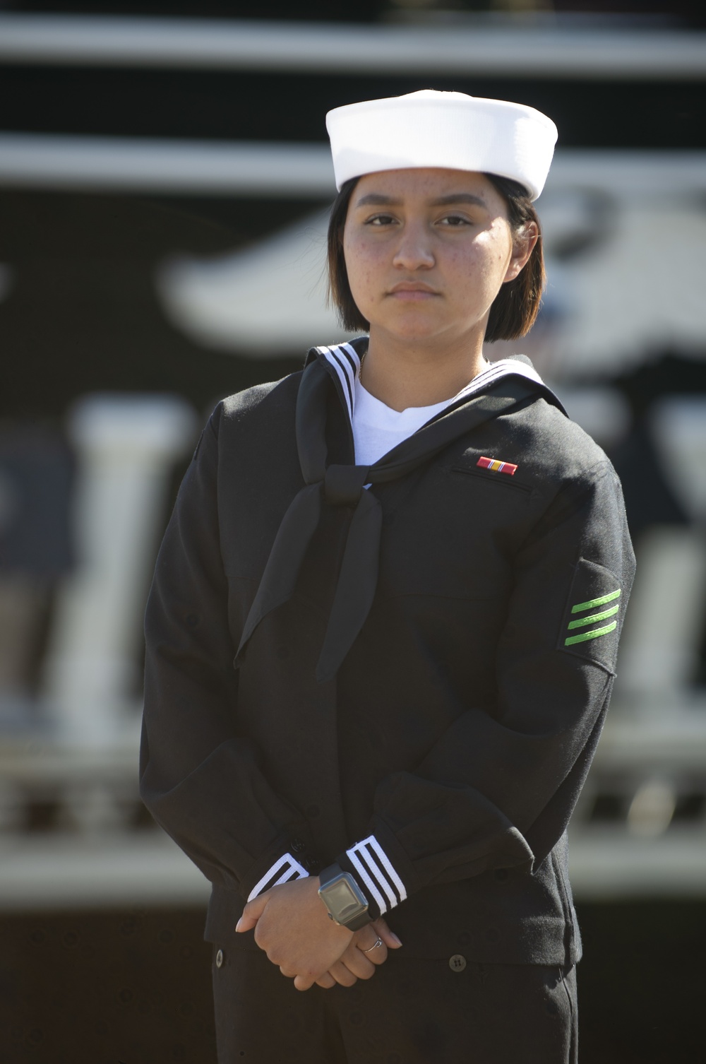 SN Jennifer Martinez poses for a picture along side USS Constitituion.