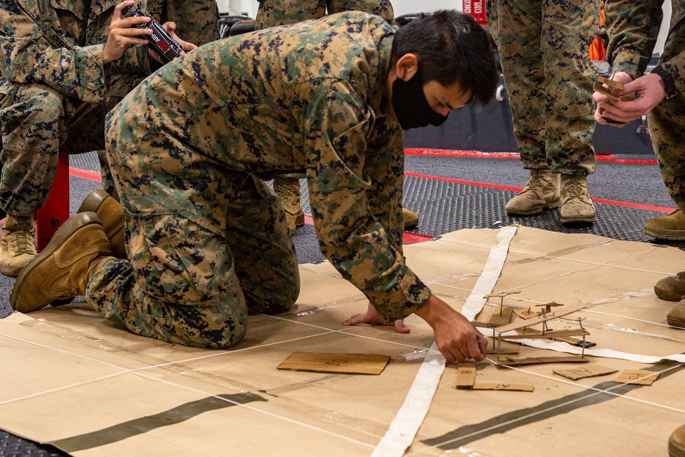 15th MEU infantry Marines build terrain model aboard USS Makin Island