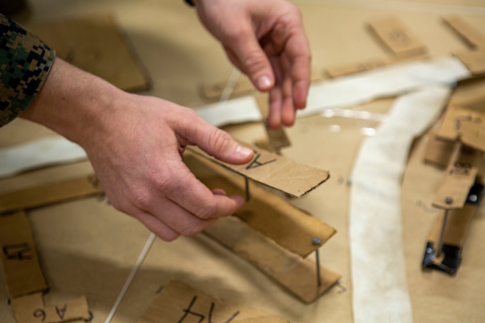 15th MEU infantry Marines build terrain model aboard USS Makin Island