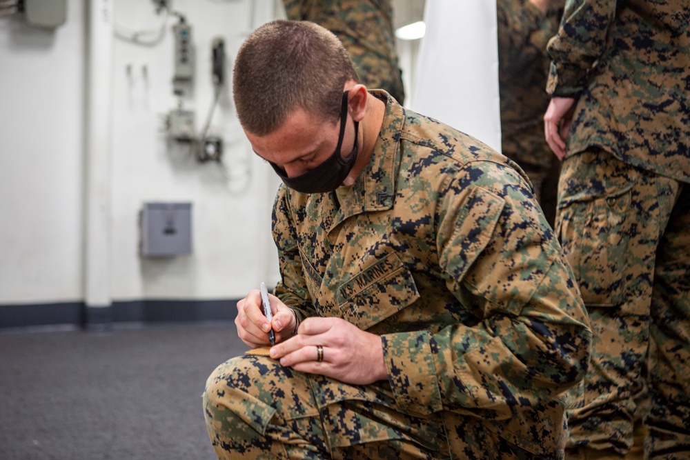 15th MEU infantry Marines build terrain model aboard USS Makin Island