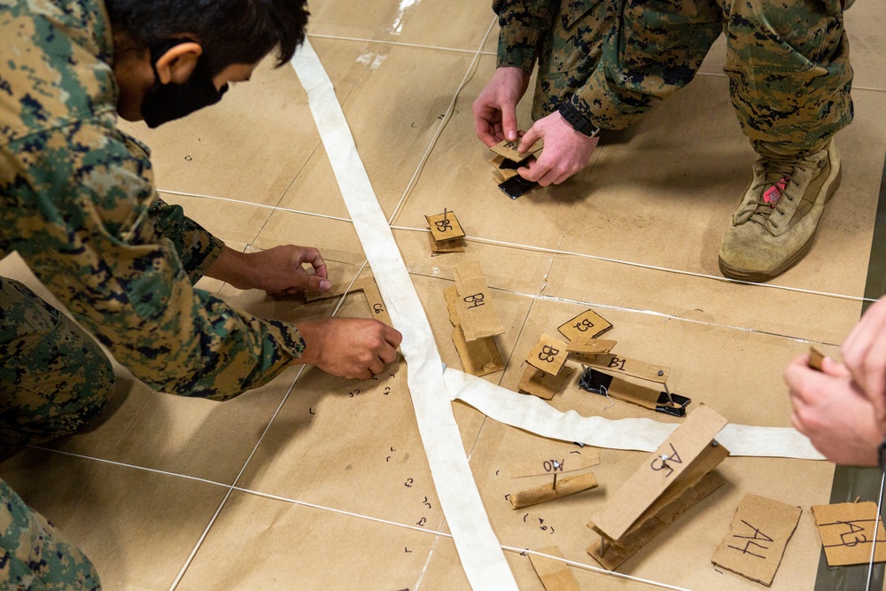 15th MEU infantry Marines build terrain model aboard USS Makin Island