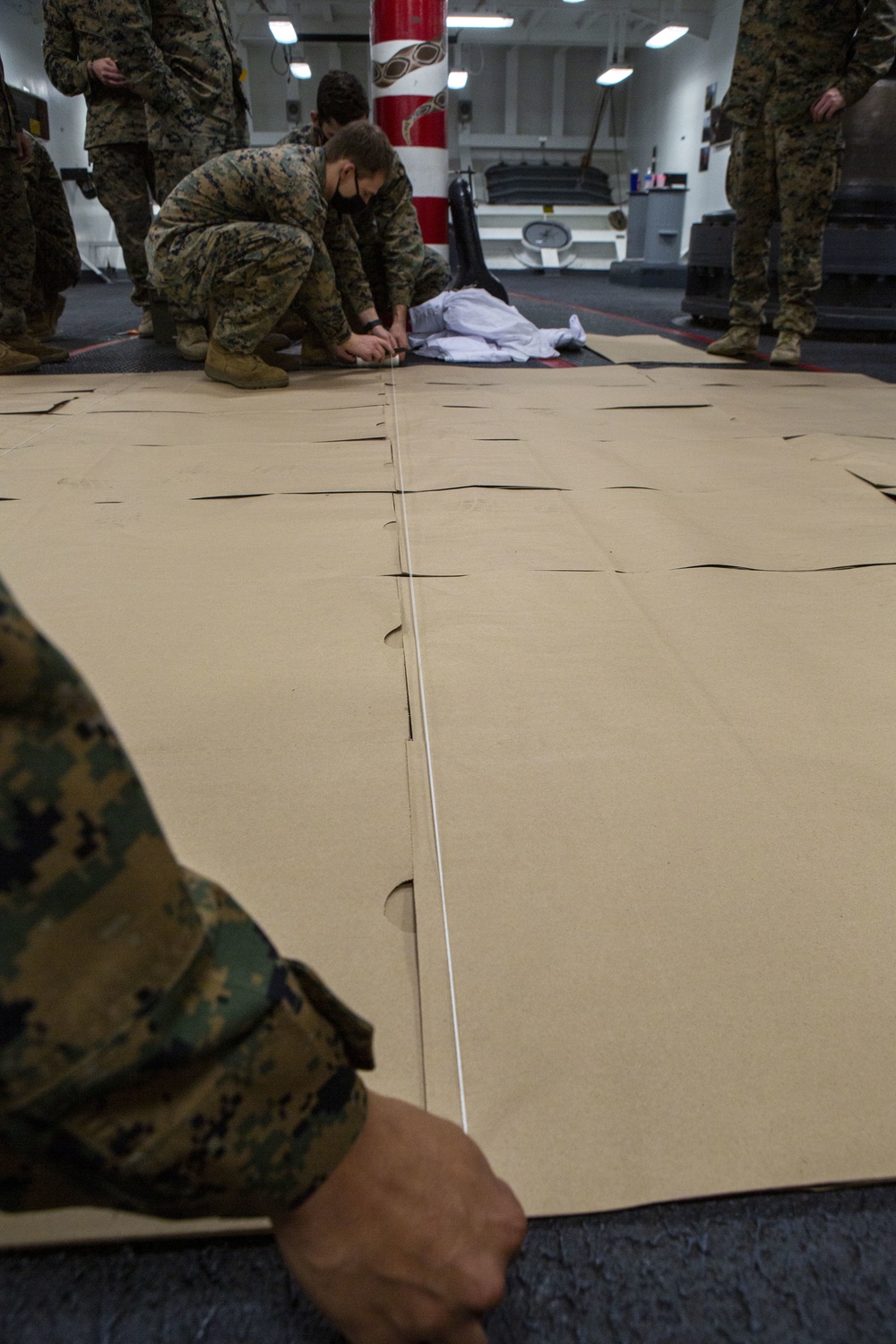 15th MEU infantry Marines build terrain model aboard USS Makin Island